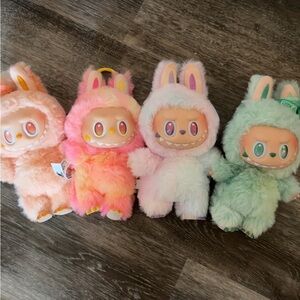 Authentic labubu dolls with boxes and cards